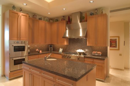 Kitchen with hardwood floor and granite counter tops.