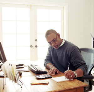 Mature man working in  home office