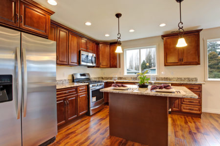 Kitchen with hardwood floor and granite counter tops.