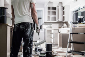 Mess of All kind of Painting Equipment in the Kitchen and Discouraged Man