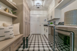 Rain boots and gingham decorated flooring in new custom home