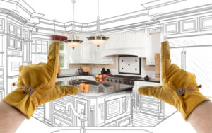 Male Contractor Hands Framing Completed Section of Custom Kitchen Design Drawing.