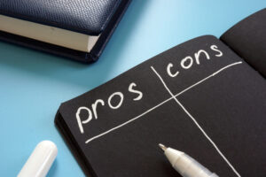 Pros and Cons list on the black page.